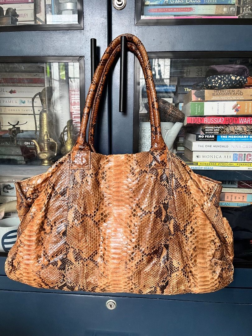 Brown Snakeskin Leather Tote Bag (Category: Tote Bags) located in Makati City. Submitted by Ina_Ndang (Listing ID 1462139414, Image 1). Description: - Spacious tote bag with a unique snakeskin pattern. - Ideal for everyday use or travel. - Ample interior space for all your essentials. - A statement piece to elevate any outfit. ~~~~~~~~~ - Approximate dimension: 19inches width, 11inches height, 9.5inches bag handles - No flaws, preloved - Payment 