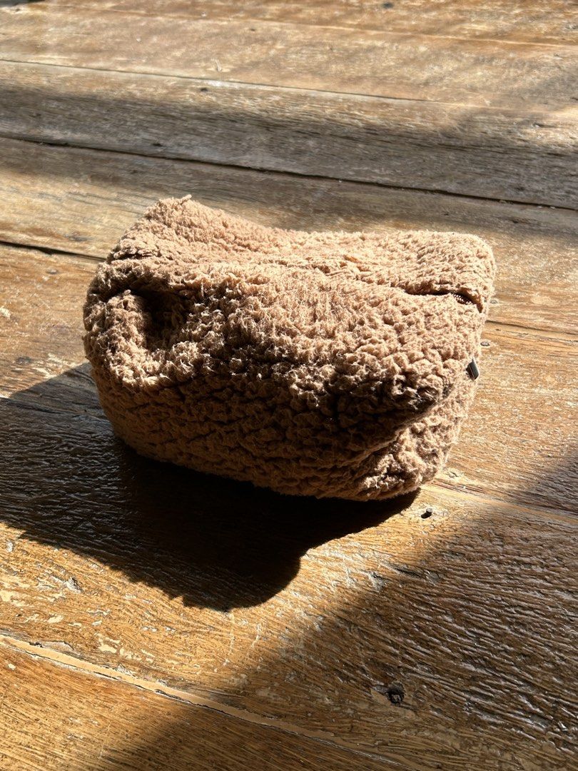 Brown Teddy Fleece Cosmetic Bag (Category: Purses & Pouches) located in Surigao. Submitted by chastnavarrete (Listing ID 1462223638, Image 1). Description: - Adorable fluffy brown cosmetic bag - Ideal size for makeup essentials - Soft, cozy, teddy bear-like material - Versatile for travel or daily use - Secure zipper closure.