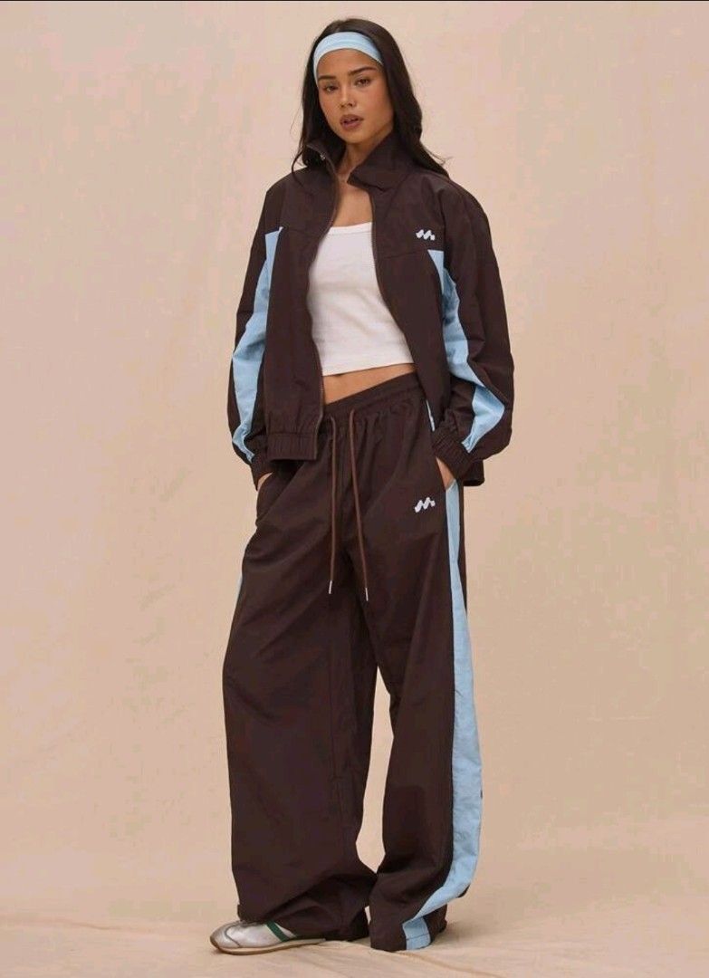 Brown Wide Leg Track Pants with Blue Stripe (Category: Other Bottoms) located in Imus. Submitted by 1521preloved (Listing ID 1462092301, Image 2). Description: Price+sf Musera Pants Brand New Waist 25-28in (stretchable) Length 42in Imus City, Cavite J&T shipping.