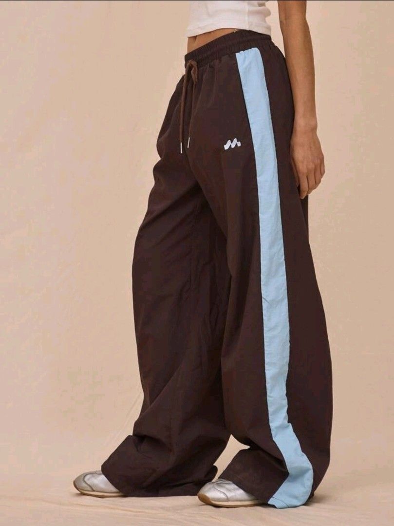 Brown Wide Leg Track Pants with Blue Stripe (Category: Other Bottoms) located in Imus. Submitted by 1521preloved (Listing ID 1462092301, Image 3). Description: Price+sf Musera Pants Brand New Waist 25-28in (stretchable) Length 42in Imus City, Cavite J&T shipping.