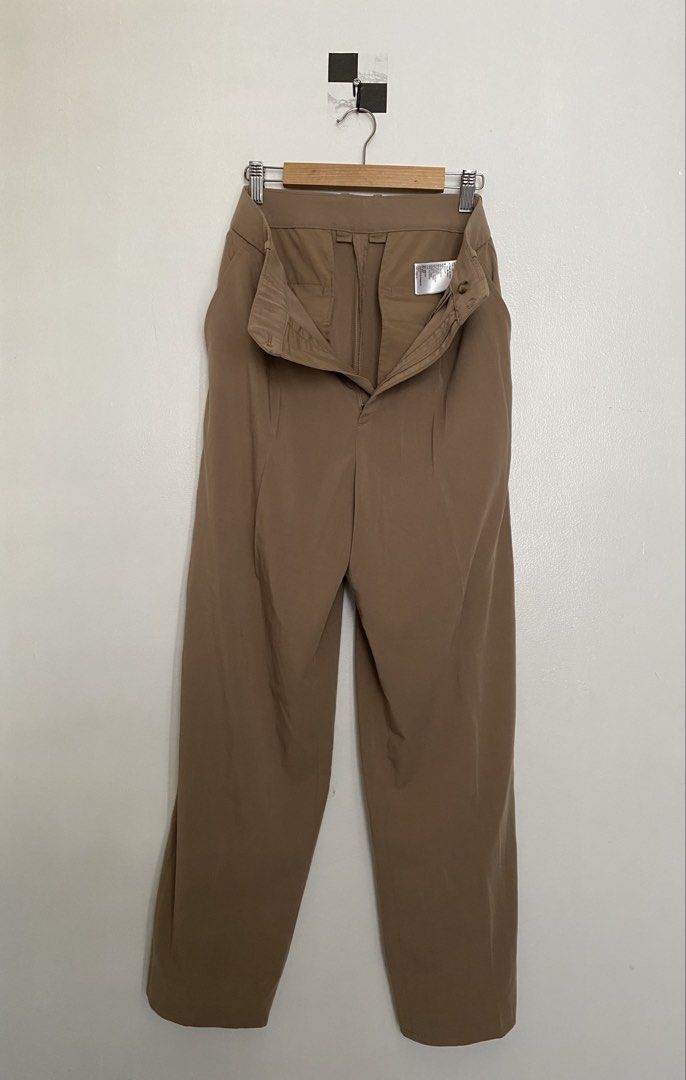 Brown Wide Leg Trousers (Category: Other Bottoms) located in Makati City. Submitted by tors.villa (Listing ID 1462040872, Image 3). Description: - Brown wide-leg trousers - High-waisted with pleated front - Button and zip closure - Two back pockets - Light and flowy fabric - Versatile for casual or work outfits Pls refer to 4th pic for measurements .