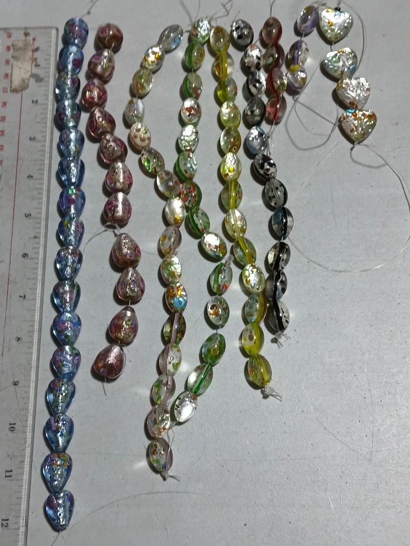 Bundle Assorted Foil Glass Beads Strands for Jewelry Making (Category: Craft Supplies & Tools) located in Marikina City. Submitted by my-an (Listing ID 1462100321, Image 3). Description: Bundle Assorted Foil Glass Beads Strands for Jewelry Making - Assorted beautiful glass beads with foil accents - Various shapes: teardrop, oval, heart - Colorful floral patterns and iridescent finishes - Ideal for crafting unique necklaces, bracelets, and DIY pro