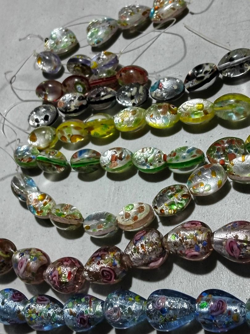 Bundle Assorted Foil Glass Beads Strands for Jewelry Making (Category: Craft Supplies & Tools) located in Marikina City. Submitted by my-an (Listing ID 1462100321, Image 2). Description: Bundle Assorted Foil Glass Beads Strands for Jewelry Making - Assorted beautiful glass beads with foil accents - Various shapes: teardrop, oval, heart - Colorful floral patterns and iridescent finishes - Ideal for crafting unique necklaces, bracelets, and DIY pro