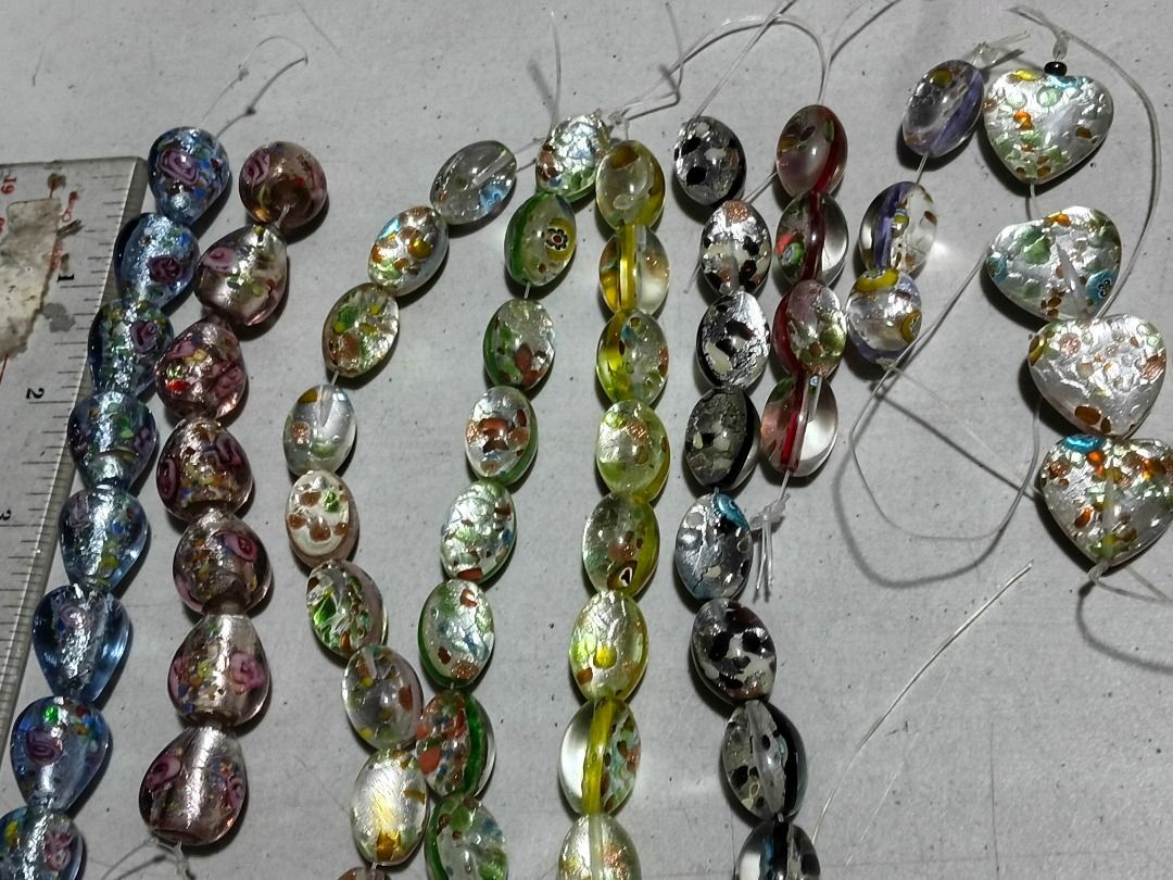 Bundle Assorted Foil Glass Beads Strands for Jewelry Making (Category: Craft Supplies & Tools) located in Marikina City. Submitted by my-an (Listing ID 1462100321, Image 1). Description: Bundle Assorted Foil Glass Beads Strands for Jewelry Making - Assorted beautiful glass beads with foil accents - Various shapes: teardrop, oval, heart - Colorful floral patterns and iridescent finishes - Ideal for crafting unique necklaces, bracelets, and DIY pro