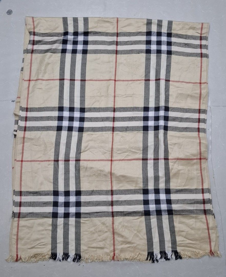 Burberry London Check Scarf (Category: Scarves) located in Pasay City. Submitted by al1son18 (Listing ID 1462144999, Image 1). Description: - Authentic Burberry London scarf - Classic beige check pattern with black, white, and red stripes - Features fringed edges - Approximate measurements: [insert length] by [insert width] - A versatile accessory to elevate any outfit.