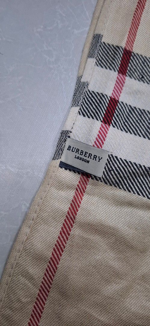 Burberry London Check Scarf (Category: Scarves) located in Pasay City. Submitted by al1son18 (Listing ID 1462144999, Image 2). Description: - Authentic Burberry London scarf - Classic beige check pattern with black, white, and red stripes - Features fringed edges - Approximate measurements: [insert length] by [insert width] - A versatile accessory to elevate any outfit.