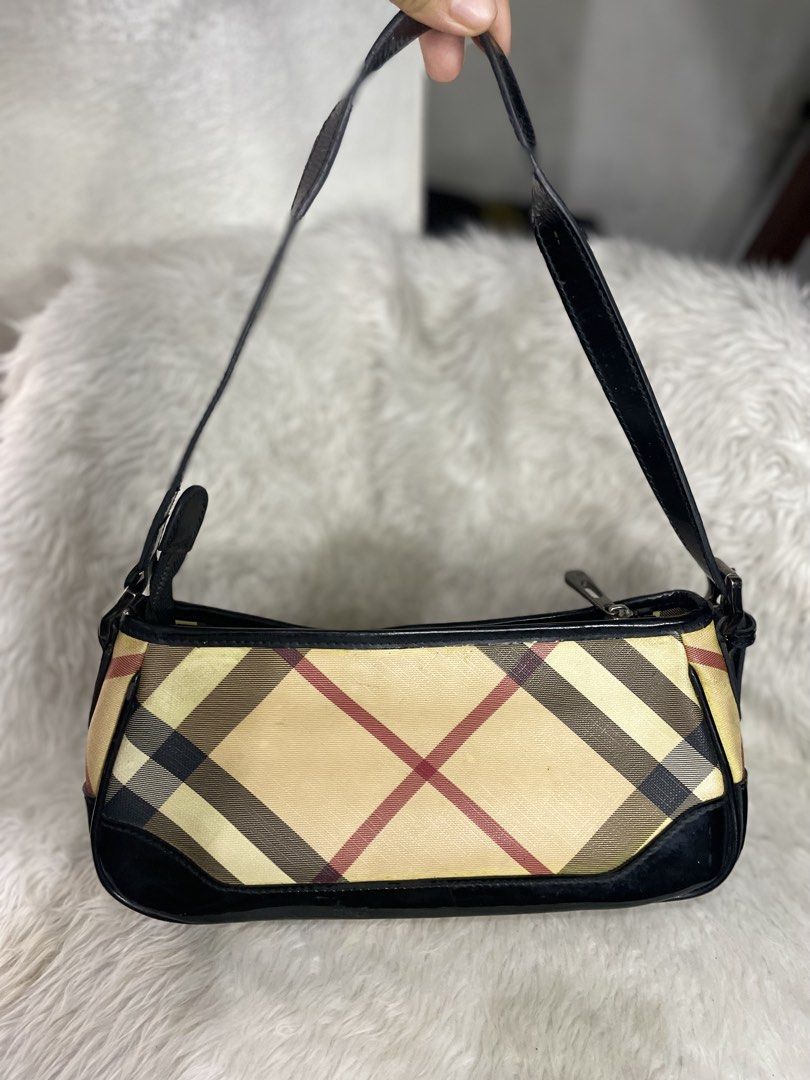 Burberry nova check baguette (Category: Luxury Bags & Wallets) located in Malabon City. Submitted by bagelyasnilucas (Listing ID 1462037352, Image 1). Description: With light pen marks on the side of the bag not too visible Other than that, the bag is still nice.