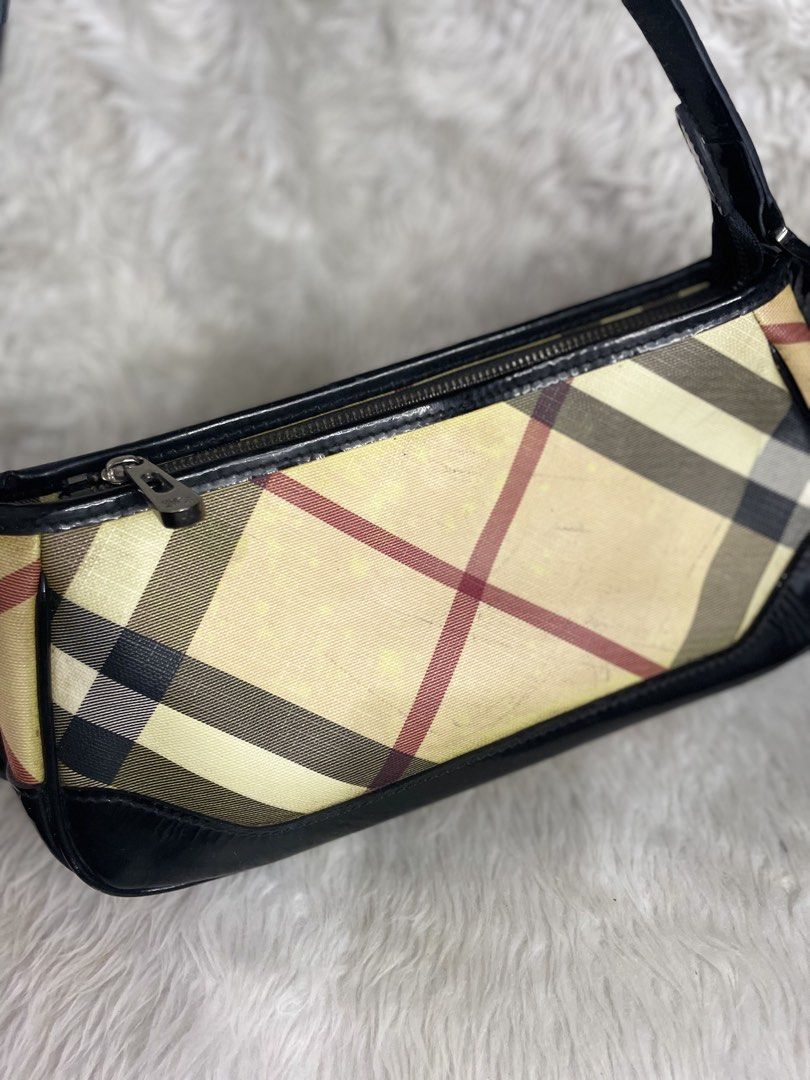 Burberry nova check baguette (Category: Luxury Bags & Wallets) located in Malabon City. Submitted by bagelyasnilucas (Listing ID 1462037352, Image 3). Description: With light pen marks on the side of the bag not too visible Other than that, the bag is still nice.