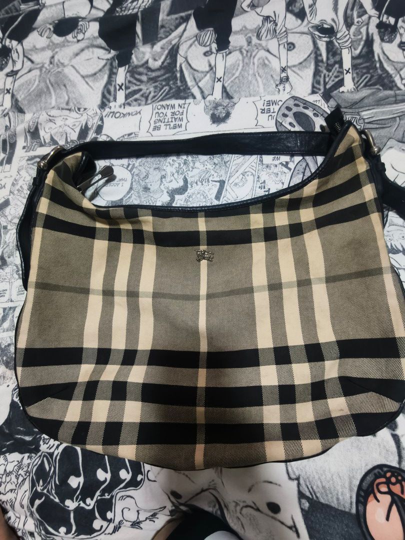 Burberry Nova Check Hobo Bag 💯% Authentic (Category: Luxury Bags & Wallets) located in Las Pinas. Submitted by live_marticko (Listing ID 1462071641, Image 1). Description: Burberry Nova Check Hobo Bag 💯% Authentic - Classic Burberry hobo bag - Iconic Nova Check pattern - Leather trim and strap - Zipper closure - Perfect for everyday use.