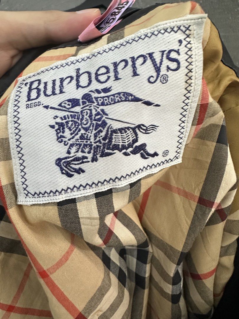Burberrys Trench Coat Double Breasted Nova Check Lining (Category: Coats, Jackets and Outerwear) located in Manila. Submitted by declutterpromax (Listing ID 1462082946, Image 3). Description: - Classic Burberry trench coat - Double-breasted design with button closure - Iconic Nova Check lining - Perfect for layering - Timeless wardrobe essential - Sharp and stylish.