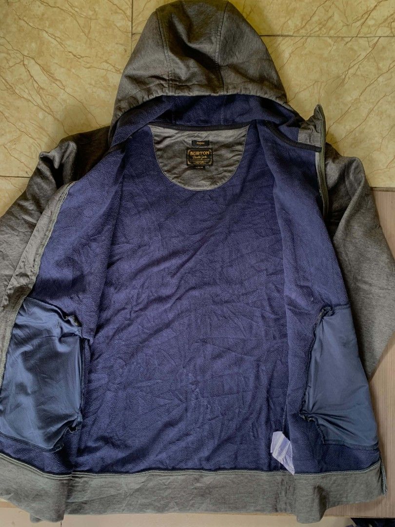 Burton Crafted and Engineered Zip-Up Hoodie (Category: Coats, Jackets and Outerwear) located in Quezon City. Submitted by chic.on.a.dime (Listing ID 1462064540, Image 3). Description: - Grey Burton zip-up hoodie - Features 'Crafted and Engineered' graphic with mountains and 'Burton Durable Goods' text - Drawstring hood - Zippered pockets - Lined with soft blue material - Ideal for casual wear or outdoor activities - minimal issue, see last pictur
