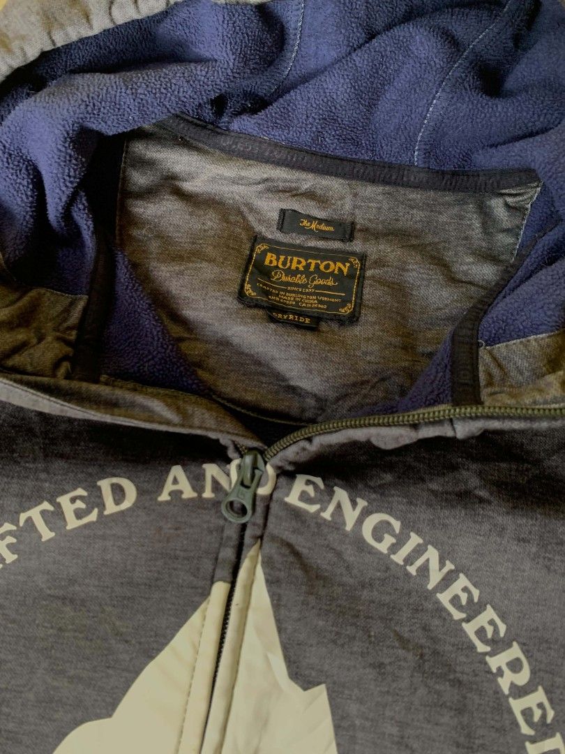 Burton Crafted and Engineered Zip-Up Hoodie (Category: Coats, Jackets and Outerwear) located in Quezon City. Submitted by chic.on.a.dime (Listing ID 1462064540, Image 2). Description: - Grey Burton zip-up hoodie - Features 'Crafted and Engineered' graphic with mountains and 'Burton Durable Goods' text - Drawstring hood - Zippered pockets - Lined with soft blue material - Ideal for casual wear or outdoor activities - minimal issue, see last pictur