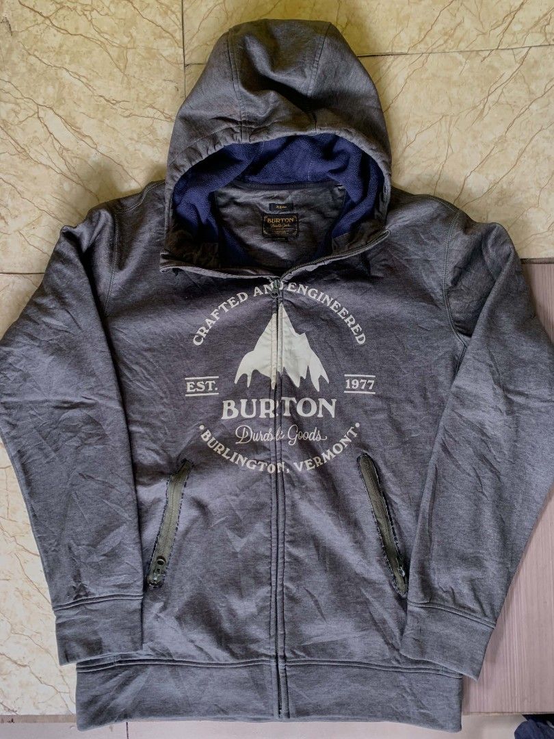 Burton Crafted and Engineered Zip-Up Hoodie (Category: Coats, Jackets and Outerwear) located in Quezon City. Submitted by chic.on.a.dime (Listing ID 1462064540, Image 1). Description: - Grey Burton zip-up hoodie - Features 'Crafted and Engineered' graphic with mountains and 'Burton Durable Goods' text - Drawstring hood - Zippered pockets - Lined with soft blue material - Ideal for casual wear or outdoor activities - minimal issue, see last pictur