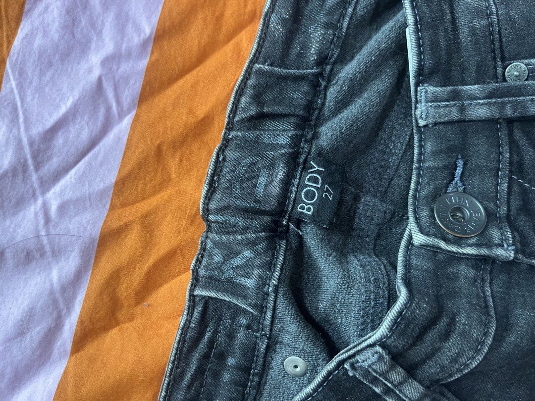 Calvin Klein Jeans Black Denim Size 27 (Category: Jeans) located in Mandaluyong City. Submitted by hopeworldplane (Listing ID 1462204537, Image 2). Description: - Brand: Calvin Klein - Type: Black Denim Jeans - Size: 27 - Features: Distressed look, small rip on right leg - Closure: Button and zip - Style: Classic five-pocket - Occasion: Casual wear.