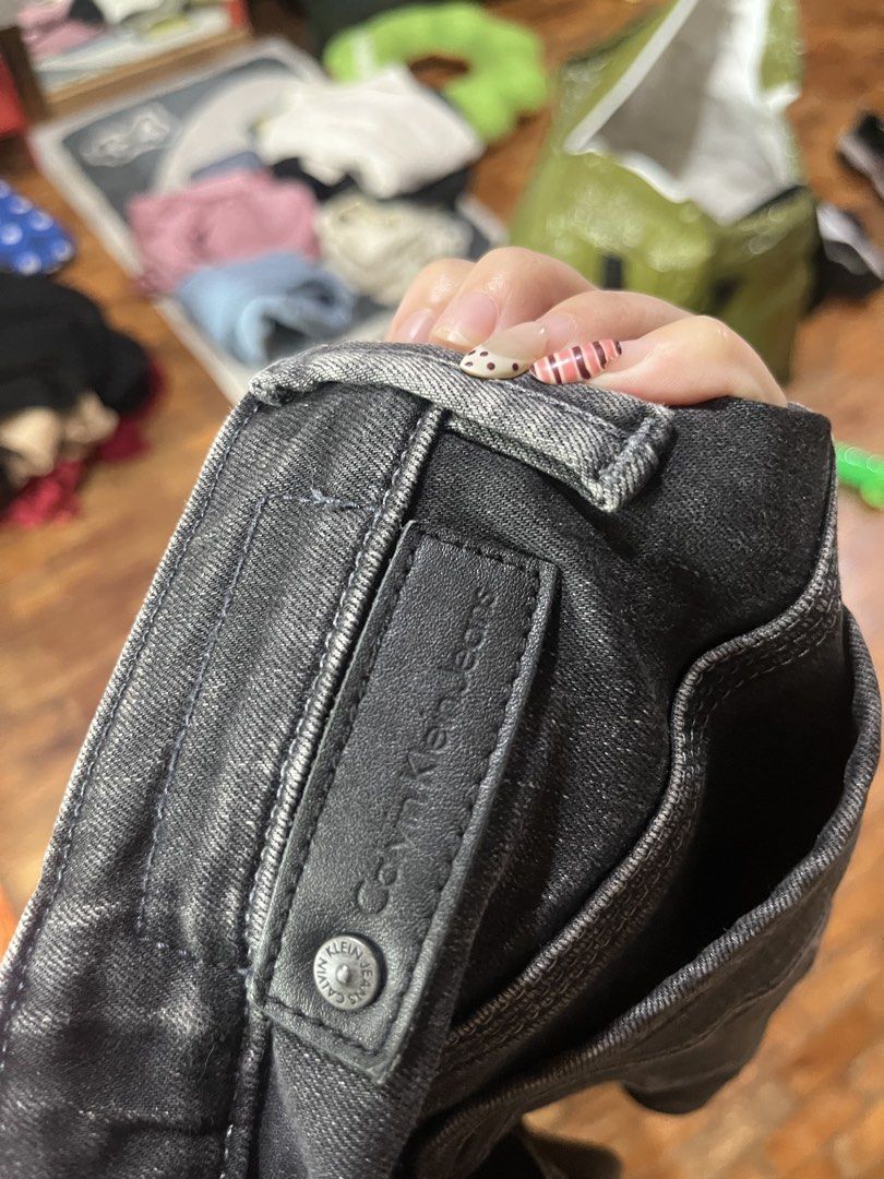 Calvin Klein Jeans Black Denim Size 27 (Category: Jeans) located in Mandaluyong City. Submitted by hopeworldplane (Listing ID 1462204537, Image 3). Description: - Brand: Calvin Klein - Type: Black Denim Jeans - Size: 27 - Features: Distressed look, small rip on right leg - Closure: Button and zip - Style: Classic five-pocket - Occasion: Casual wear.