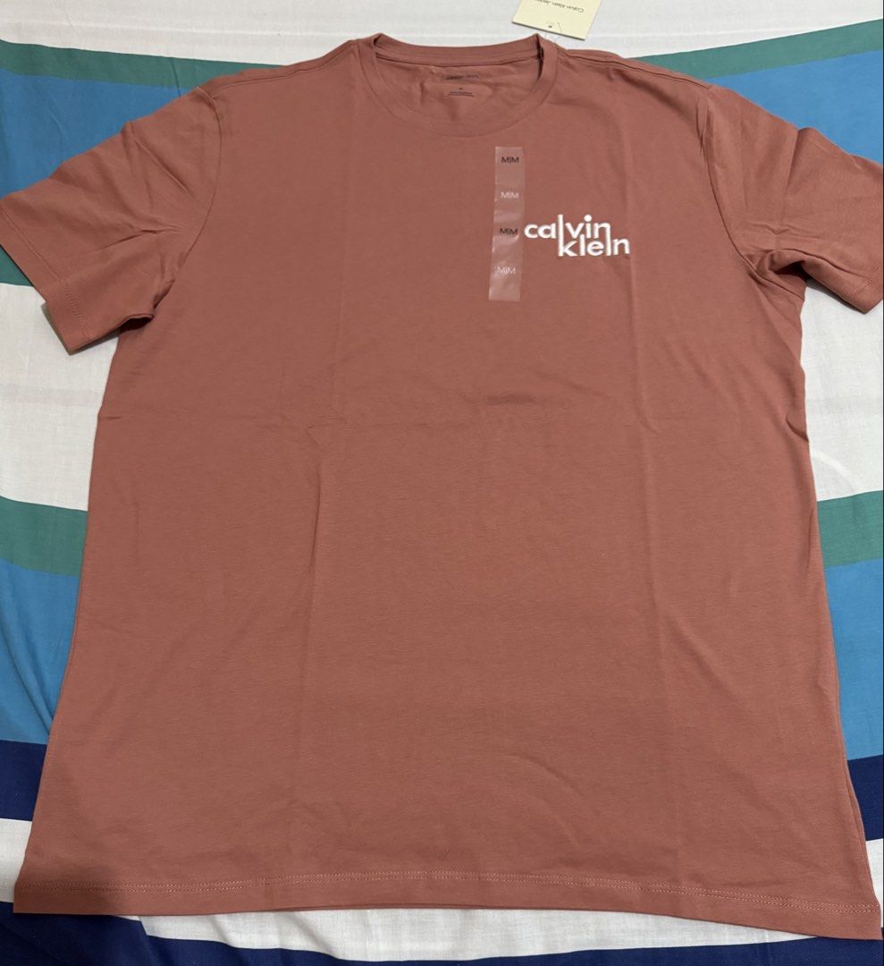 Calvin Klein Men Shirt (Category: Announcements) located in Quezon City. Submitted by branded_jo (Listing ID 1462050026, Image 1). Description: Original Calvin Klein Men Shirt Med in tag Color - Salmon Brand new with tag Bought in Canada Lalamove Ready.