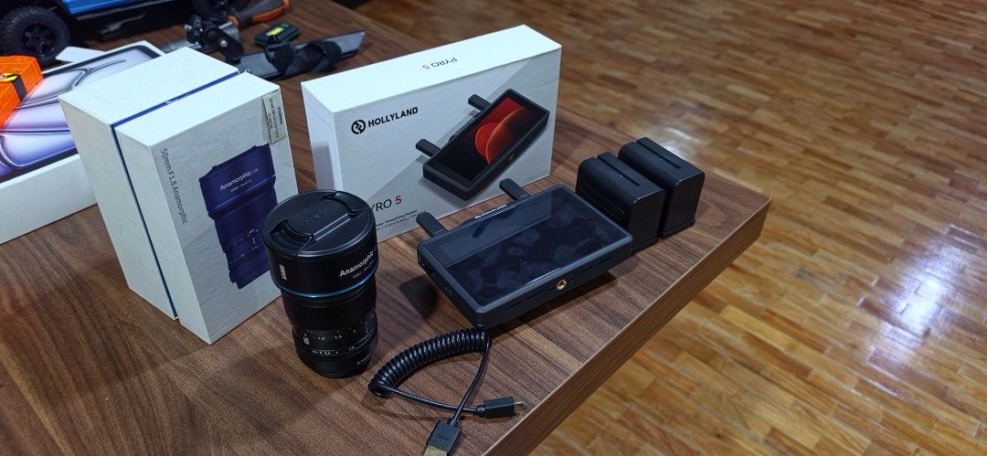 Camera Gear (Category: Other Accessories) located in Manila. Submitted by aint.aika (Listing ID 1462053400, Image 2). Description: For Sale: (Prices still Included) ~ Fujifilm Sirui 50mm F1.8 Anamorphic Lense (38,000 pesos) ~ Hollyland Pyro 5 Wireless Transceiving Monitor (21,500 pesos) ~ SmallRig NP-F970 Battery and Charger kit (4,000 pesos) **58,500 pesos if take everything !Reason for Sale: Not needed and barely used, just opened !Inclusions: 