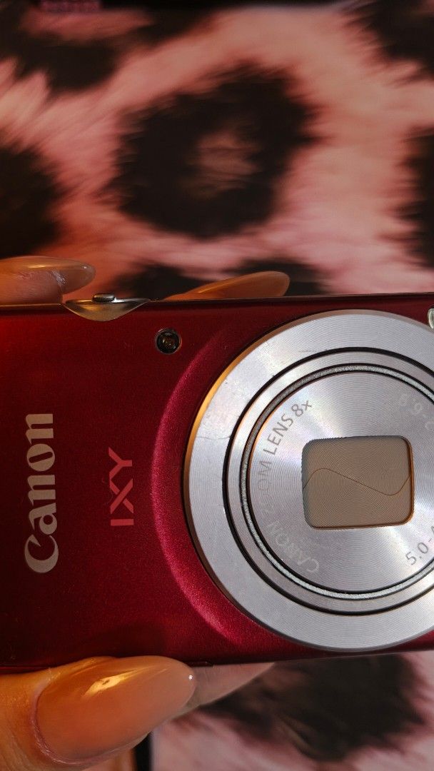 Canon IXY 200 / IXUS 185 Red Digital Camera (Category: Cameras) located in Quezon City. Submitted by lavender.latte (Listing ID 1462191687, Image 2). Description: Selling my Canon IXY 200 / IXUS 185 Red digital camera! Bought it for ₱9000, selling for ₱8500, but willing to go down to ₱8000 for sure and easy buyers! Bought it from an IG reseller that buys cameras from Japan. Nearly in good condition, but please see slides for the scratches on the 