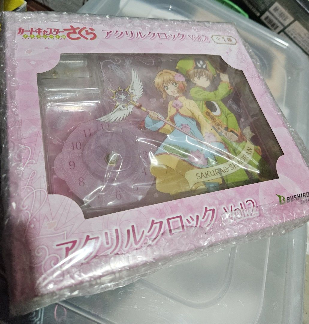 Cardcaptor Sakura Acrylic Clock Vol. 2 (Category: Clocks) located in Pasig City. Submitted by ccsakura4 (Listing ID 1462155440, Image 1). Description: - Cardcaptor Sakura Acrylic Clock (Vol. 2) - Features beloved characters Sakura and Syaoran - Stylish purple clock face with clear numbers - Brand new and still in original packaging - A must-have collectible for any Cardcaptor Sakura fan!.