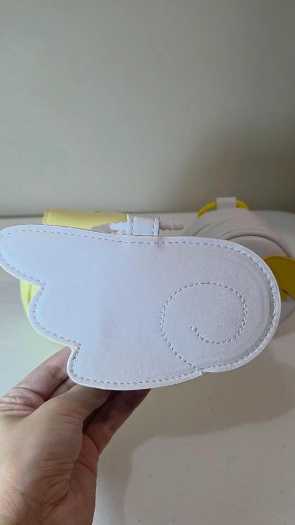 Cardcaptor Sakura GSC Earphone Case (Category: Clutches) located in Pasig City. Submitted by ccsakura4 (Listing ID 1462154311, Image 2). Description: - CCS Earphone Case - Unique wing shape - Features a delicate swirl detail on one side - Compact and easy to carry.