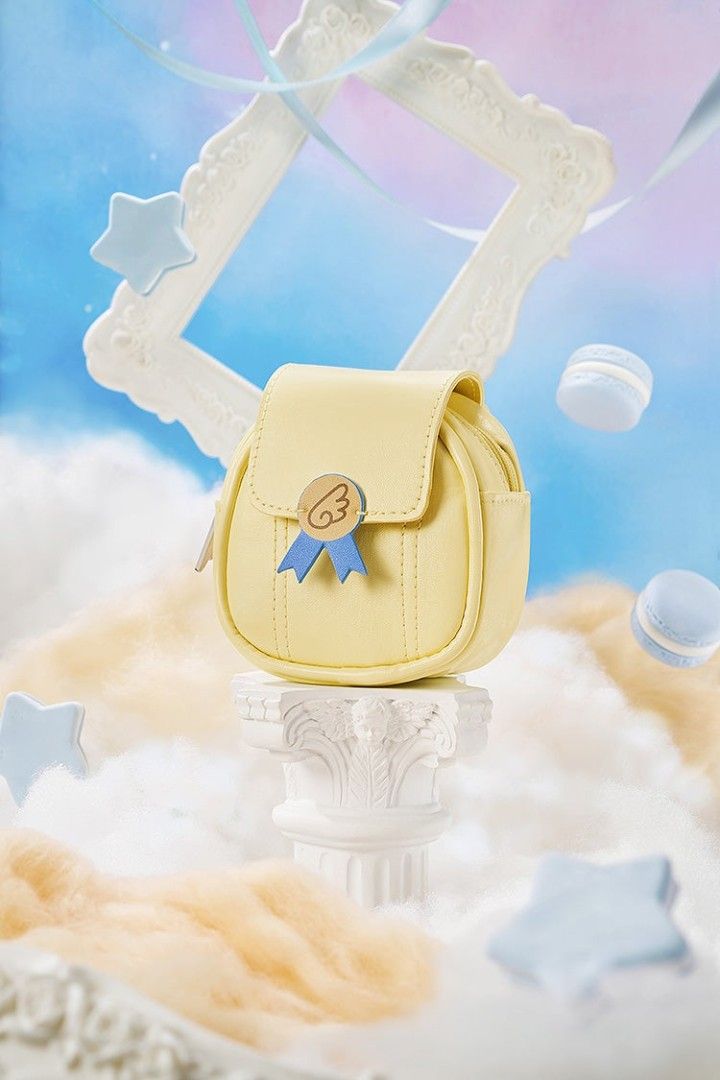 Cardcaptor Sakura GSC Earphone Case (Category: Purses & Pouches) located in Pasig City. Submitted by ccsakura4 (Listing ID 1462156372, Image 1). Description: - Adorable yellow coin purse - Round shape, easy to carry - Features a cute ribbon and wing charm - Secure zipper closure - Ideal for organizing small essentials - Compact size fits in pockets or small bags.