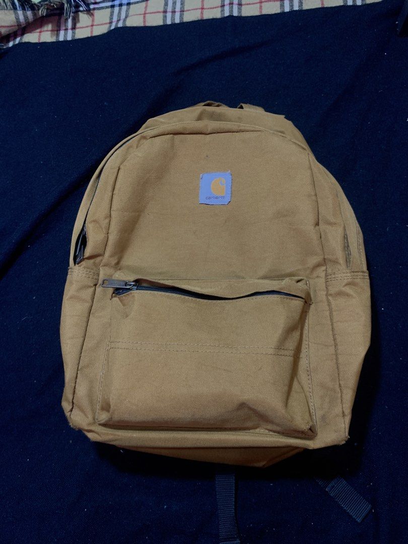 Carhartt Backpack Tan Canvas (Category: Backpacks) located in Cagayan de Oro. Submitted by chabermz (Listing ID 1462225808, Image 1). Description: - Classic tan Carhartt backpack - Durable canvas material - Main compartment and front zip pocket - Adjustable straps - Plenty of life left for daily use or school.