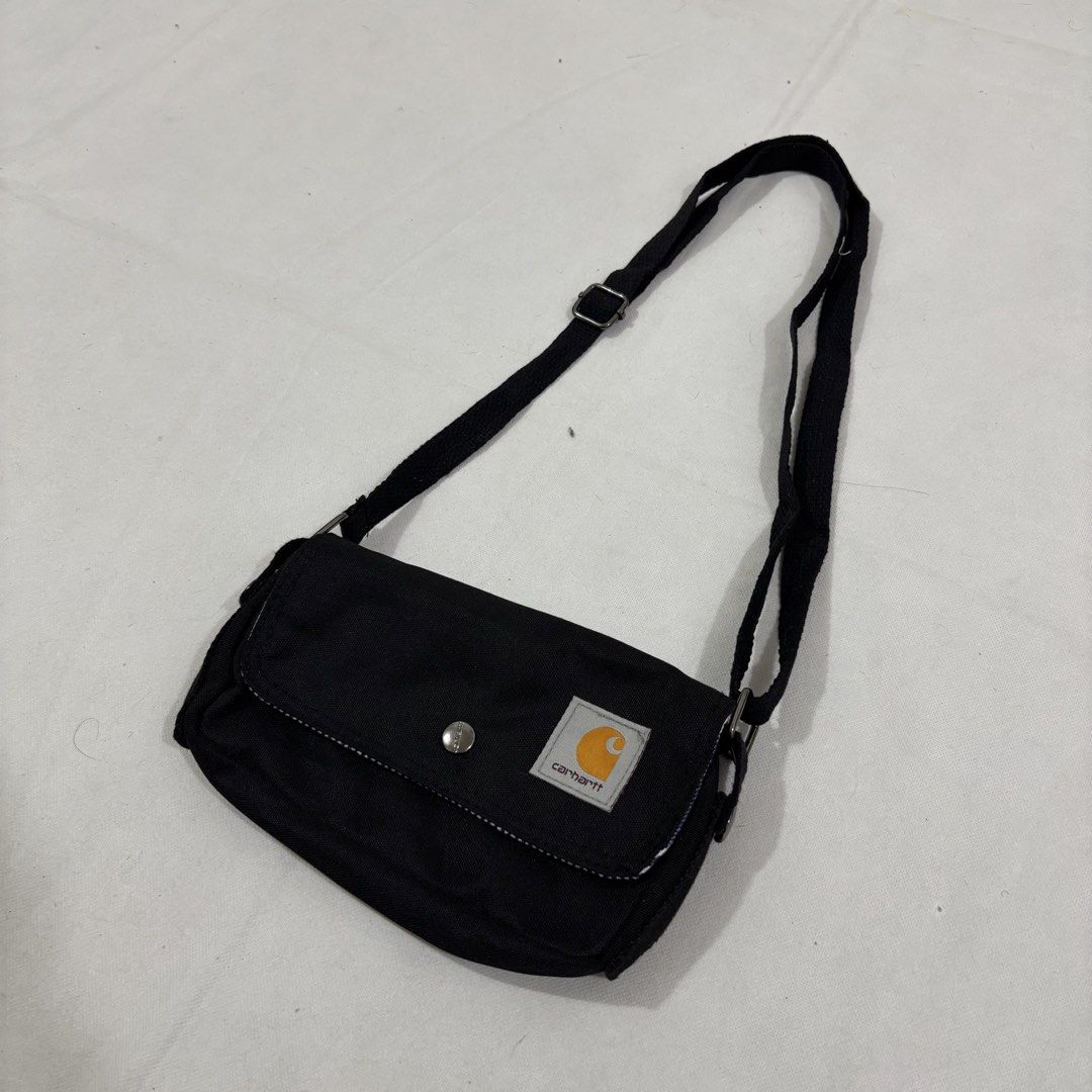 Carhartt Black Crossbody Bag (Category: Sling Bags) located in Cavite. Submitted by itsayaaa (Listing ID 1462093266, Image 2). Description: - Black Carhartt crossbody bag - Adjustable strap for comfortable wear - Main compartment with secure zipper closure - Interior features a stylish striped lining - Simple, functional, and great for everyday use - Perfectly fits your daily essentials.