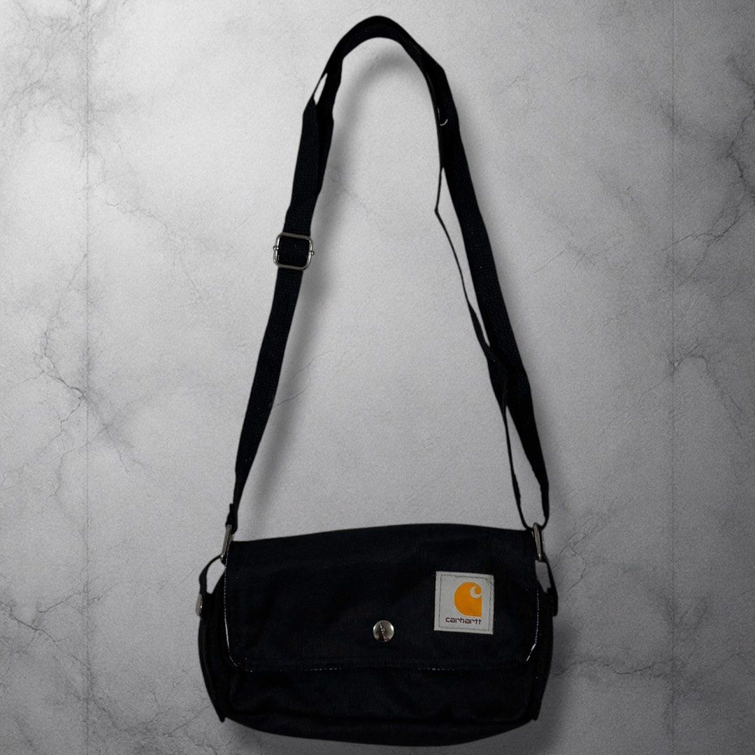 Carhartt Black Crossbody Bag (Category: Sling Bags) located in Cavite. Submitted by itsayaaa (Listing ID 1462093266, Image 1). Description: - Black Carhartt crossbody bag - Adjustable strap for comfortable wear - Main compartment with secure zipper closure - Interior features a stylish striped lining - Simple, functional, and great for everyday use - Perfectly fits your daily essentials.