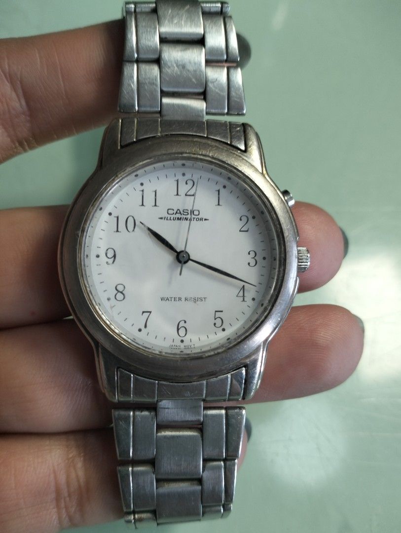 Casio Illuminator Water Resist Watch (Category: Men's Watches) located in General Mariano Alvarez. Submitted by ma.miafajardo1219 (Listing ID 1462053389, Image 1). Description: Casio watch with Illuminator and Water Resist features. Silver metal strap. The watch face is white with clear numbers. Some signs of wear on the metal strap and casing. Price tag shows 1200.sale now for only 1000.
