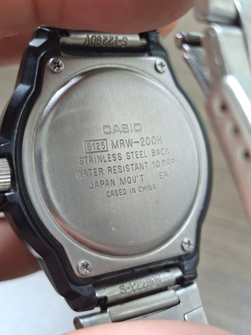 Casio MRW-200H (Category: Men's Watches) located in Quezon City. Submitted by fleetingticks (Listing ID 1462138458, Image 2). Description: Up for sale is a classic, highly reliable Casio MRW-200H analog sport watch. Featuring a high-contrast black dial with bold white Arabic numerals, this watch offers exceptional readability at a glance. It includes a functional day/date display and a sporty rotating bezel. It is paired with a durable, adjustabl