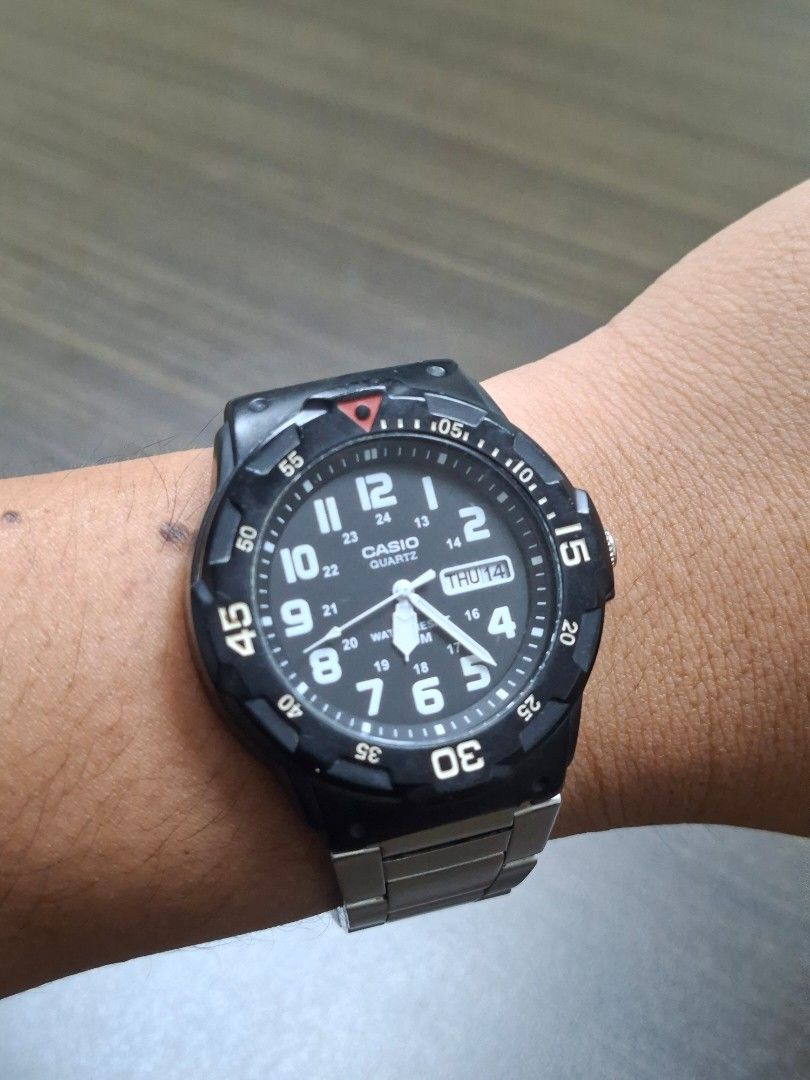 Casio MRW-200H (Category: Men's Watches) located in Quezon City. Submitted by fleetingticks (Listing ID 1462138458, Image 1). Description: Up for sale is a classic, highly reliable Casio MRW-200H analog sport watch. Featuring a high-contrast black dial with bold white Arabic numerals, this watch offers exceptional readability at a glance. It includes a functional day/date display and a sporty rotating bezel. It is paired with a durable, adjustabl