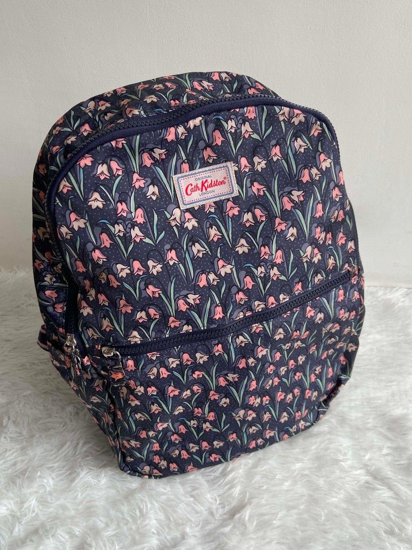 Cath Kidston Backpack Navy Floral Print (Category: Backpacks) located in Bulacan. Submitted by bella.ken.varietystore (Listing ID 1462183109, Image 1). Description: Cute Cath Kidston backpack. Features a navy blue base with a pretty floral print all over. Has two zip compartments. Adjustable straps for comfort. Great for daily use or travel. Plenty of space inside..