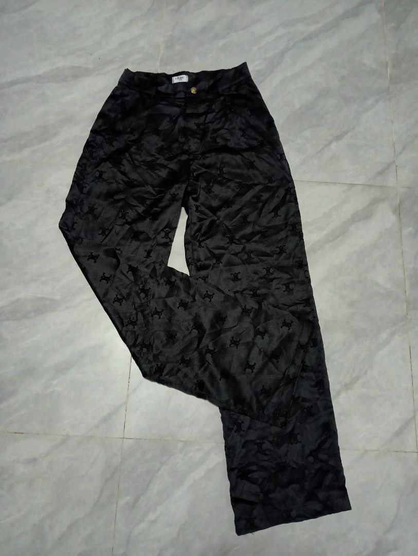 CELINE Black Monogram Wide Leg Pants (Category: Other Bottoms) located in Odiongan. Submitted by thrifthub_bundang07 (Listing ID 1462183772, Image 3). Description: - Black wide-leg pants 26 to 27 waistline 41 length 9hem - All-over CELINE monogram print - High-waisted design - Button and zip closure - Fabric with a slight sheen - Relaxed fit - Ideal for dressing up or down.