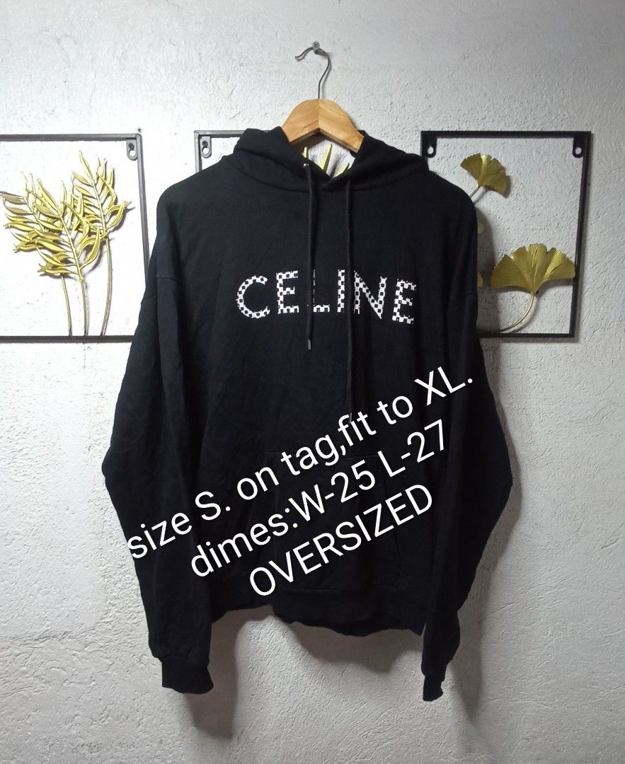 Celine Paris Hoodie (Category: Luxury Apparel) located in Kawit. Submitted by deidzdzn (Listing ID 1462100816, Image 1). Description: - Authentic Celine hoodie - Color: Black - Unique checkerboard rivet details on the front - Size on tag: S - Fits like an oversized XL - Measurements: Width 25 inches, Length 27 inches - Ideal for a relaxed and comfortable fit.