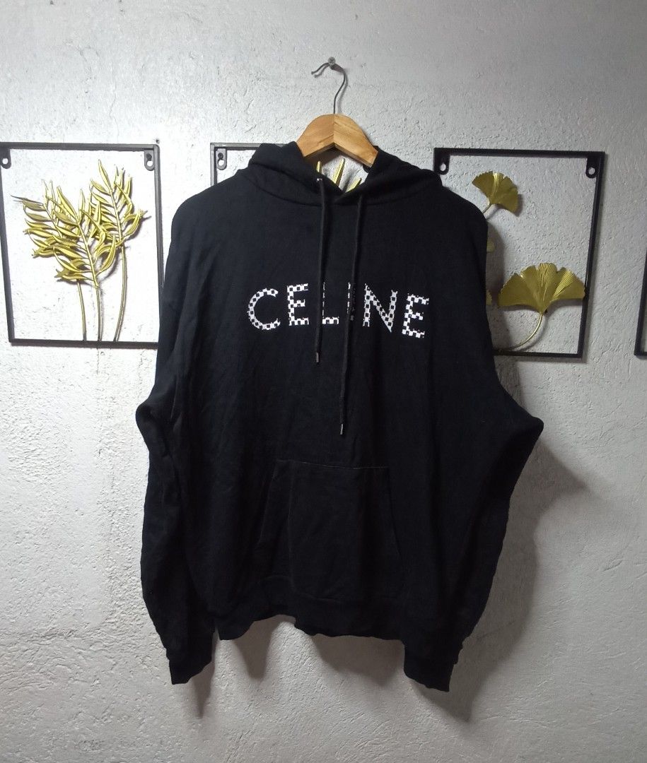 Celine Paris Hoodie (Category: Luxury Apparel) located in Kawit. Submitted by deidzdzn (Listing ID 1462100816, Image 3). Description: - Authentic Celine hoodie - Color: Black - Unique checkerboard rivet details on the front - Size on tag: S - Fits like an oversized XL - Measurements: Width 25 inches, Length 27 inches - Ideal for a relaxed and comfortable fit.