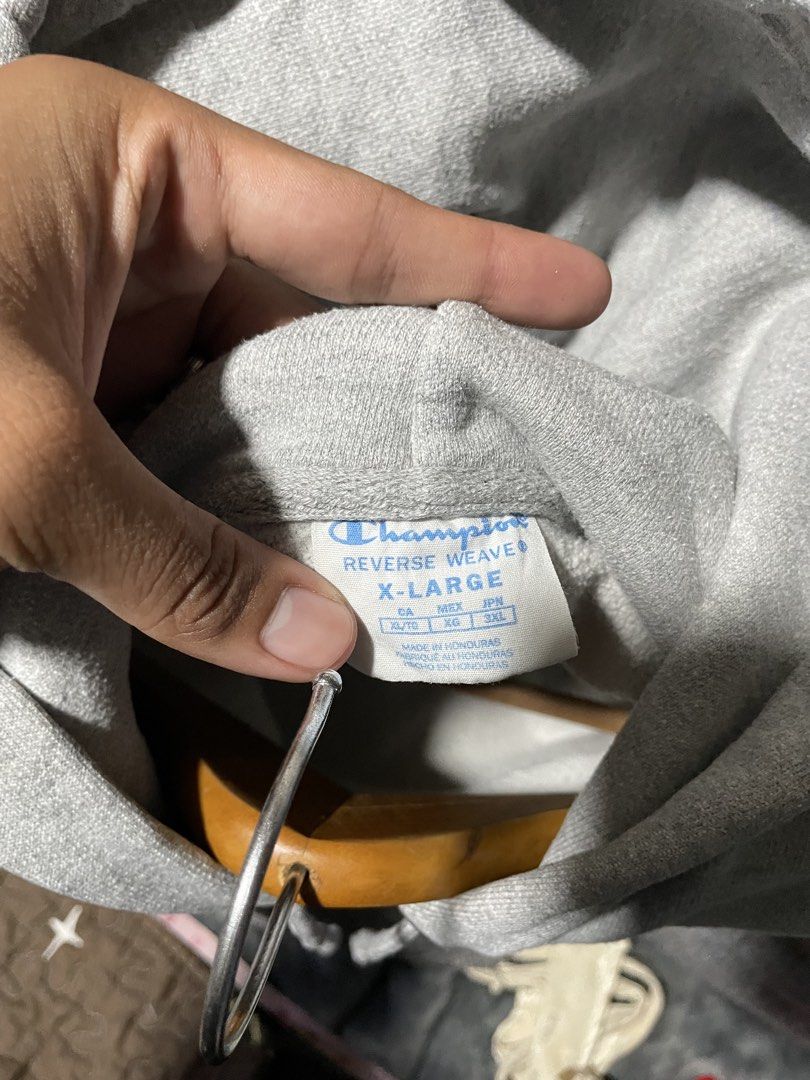 Champion Reverse Weave Grey Hoodie X-Large (Category: Hoodies) located in Caloocan City. Submitted by thrift.enough (Listing ID 1462179043, Image 3). Description: - Grey Champion Reverse Weave Hoodie - Features classic C logo on chest - Smaller C logo on sleeve - Front pocket - Minor faint stains on front pocket area - Made in Honduras.
