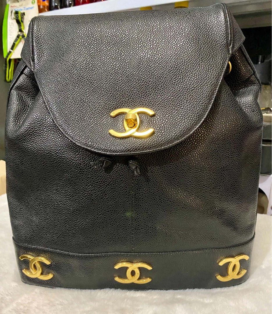 Chanel Black Caviar Leather CC Logo Backpack (Category: Luxury Bags & Wallets) located in Quezon City. Submitted by heybailey (Listing ID 1462110815, Image 1). Description: Self authenticate. Genuine caviar leather. Brass hardware. JAPAN AUCTION SOURCED - Classic Chanel backpack - Black caviar leather - Iconic CC logo on front flap and base - Gold hardware details - Drawstring closure with flap top - Adjustable leather and chain straps - Timeless
