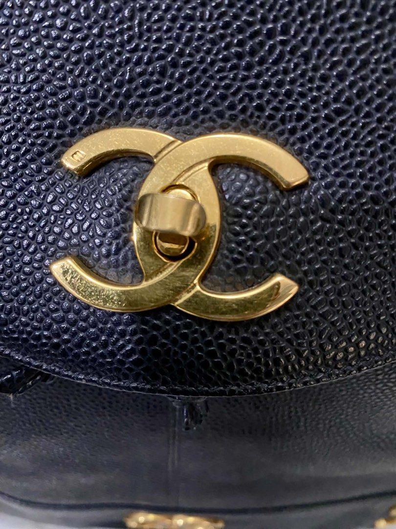 Chanel Black Caviar Leather CC Logo Backpack (Category: Luxury Bags & Wallets) located in Quezon City. Submitted by heybailey (Listing ID 1462110815, Image 3). Description: Self authenticate. Genuine caviar leather. Brass hardware. JAPAN AUCTION SOURCED - Classic Chanel backpack - Black caviar leather - Iconic CC logo on front flap and base - Gold hardware details - Drawstring closure with flap top - Adjustable leather and chain straps - Timeless