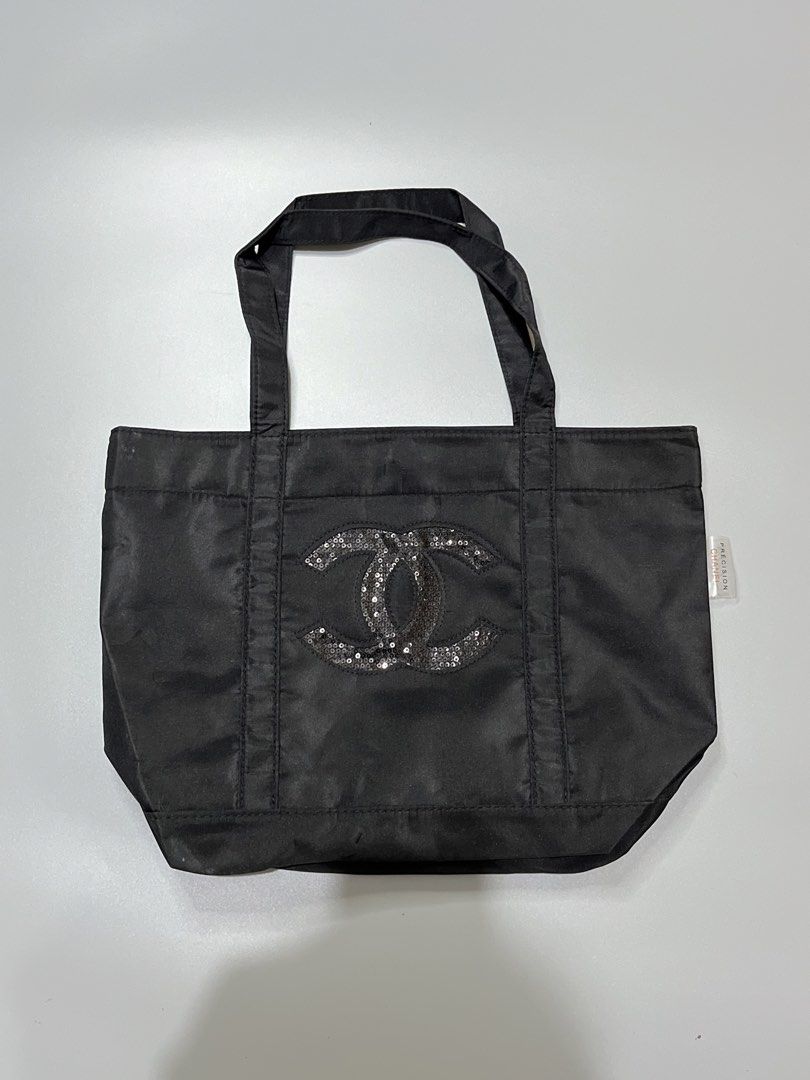 Chanel Black Sequin CC Tote Bag (Category: Luxury Bags & Wallets) located in Manila. Submitted by jorgemabelin2001 (Listing ID 1462050289, Image 1). Description: - Iconic black Chanel tote bag - Features dazzling sequined CC logo - Made from durable material - Spacious interior with secure snap closure - Sturdy and comfortable handles - Ideal for everyday use or travel - A timeless, classic piece.