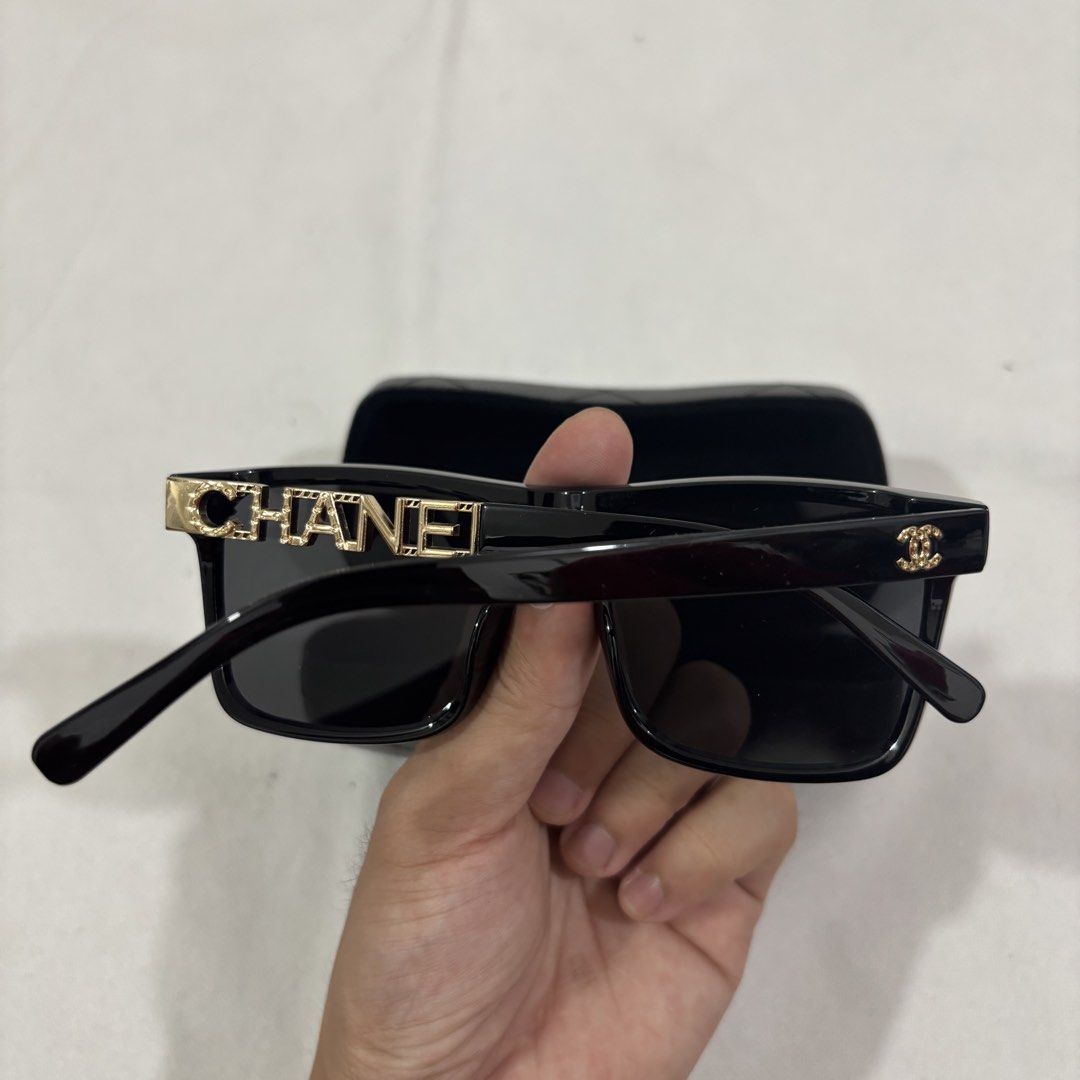 Chanel Black Square Sunglasses Gold CC Logo (Category: Sunglasses & Eyewear) located in Cavite. Submitted by itsayaaa (Listing ID 1462093242, Image 2). Description: Black acetate frames - Gold 'CHANEL' lettering on temples - Gold CC logo on the side - Made in Italy - Comes with original case Y2k.