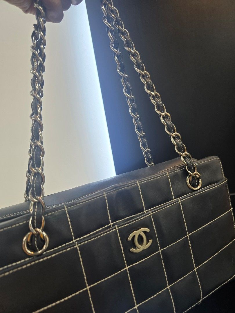 Chanel Chocolate Bar Black Square Stitch Bag (Category: Luxury Bags & Wallets) located in Taguig. Submitted by mluxeph (Listing ID 1462050724, Image 2). Description: Chanel Chocolate Bar Black Square Stitch Bag Material: Lambskin leather Stamp: 7037705 Year: 2002 - 2003 Interior: One zip pocket, one open pocket and one main compartment Measurements: 11.5”L X 3.4”W X 6.75”H Handle Drop: 9.1" Hardware: Silver tone Inclusions: Original dust bag.