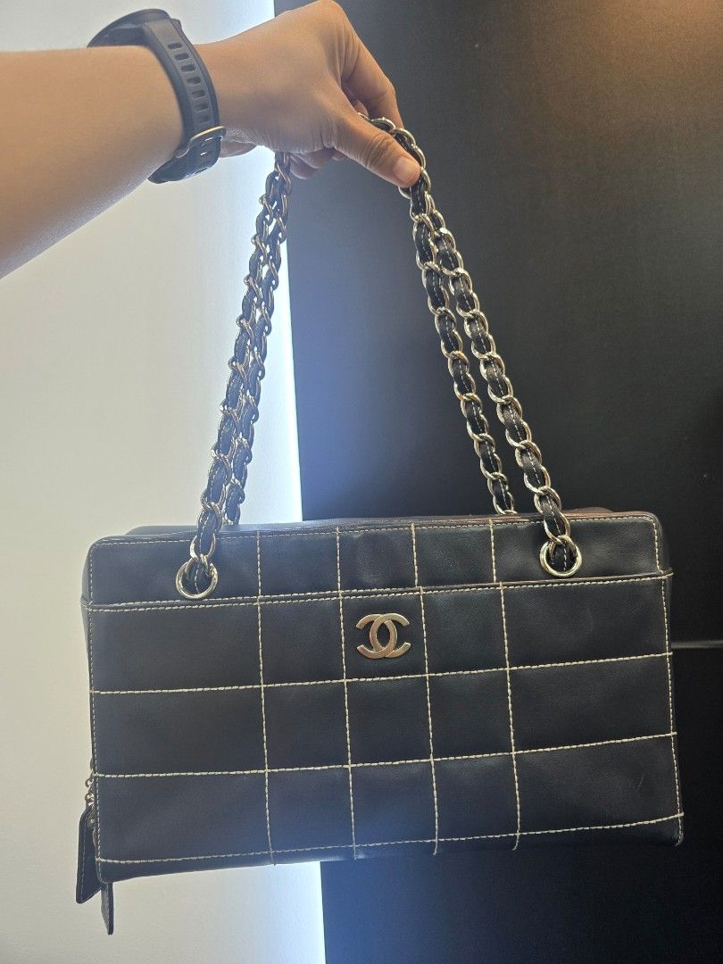 Chanel Chocolate Bar Black Square Stitch Bag (Category: Luxury Bags & Wallets) located in Taguig. Submitted by mluxeph (Listing ID 1462050724, Image 1). Description: Chanel Chocolate Bar Black Square Stitch Bag Material: Lambskin leather Stamp: 7037705 Year: 2002 - 2003 Interior: One zip pocket, one open pocket and one main compartment Measurements: 11.5”L X 3.4”W X 6.75”H Handle Drop: 9.1" Hardware: Silver tone Inclusions: Original dust bag.