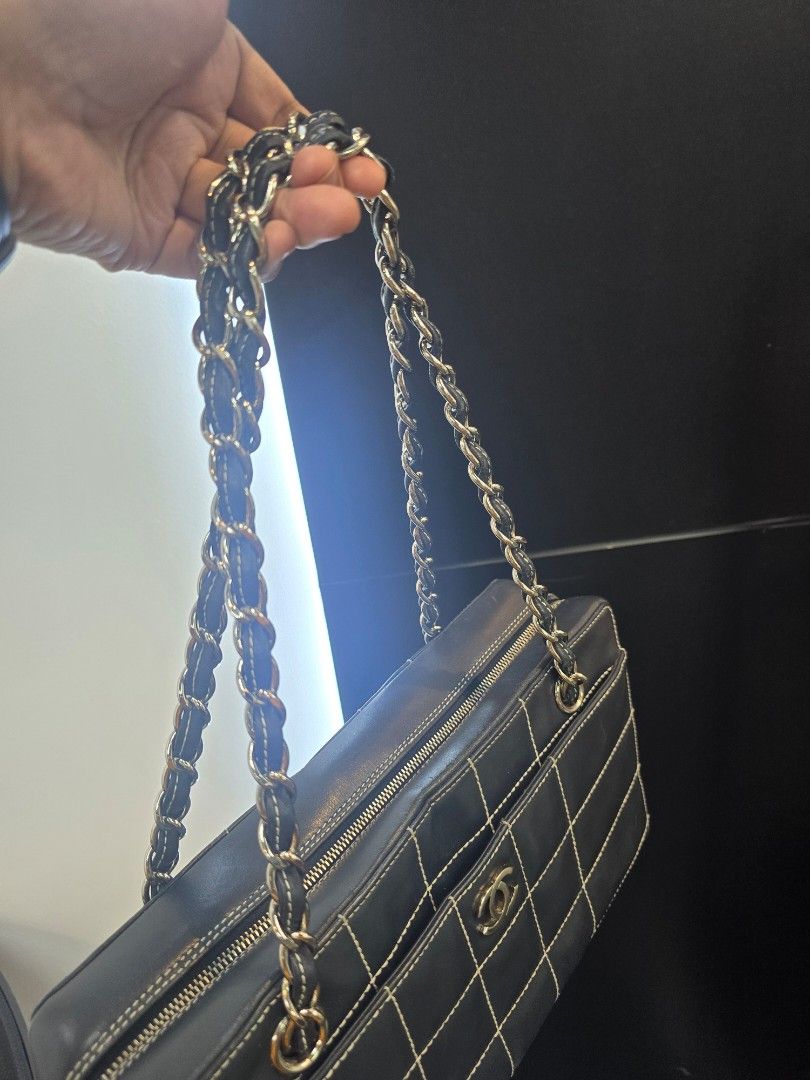Chanel Chocolate Bar Black Square Stitch Bag (Category: Luxury Bags & Wallets) located in Taguig. Submitted by mluxeph (Listing ID 1462050724, Image 3). Description: Chanel Chocolate Bar Black Square Stitch Bag Material: Lambskin leather Stamp: 7037705 Year: 2002 - 2003 Interior: One zip pocket, one open pocket and one main compartment Measurements: 11.5”L X 3.4”W X 6.75”H Handle Drop: 9.1" Hardware: Silver tone Inclusions: Original dust bag.