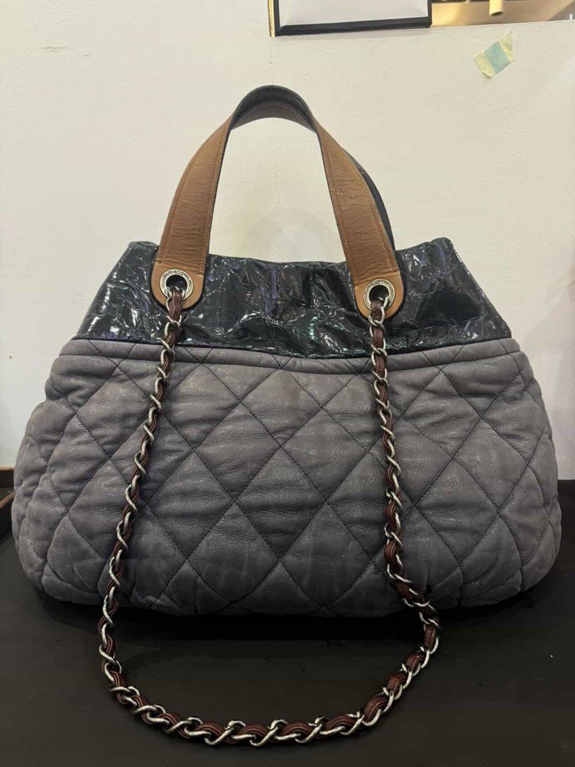 Chanel on the mix Grey Quilted Leather (Category: Luxury Bags & Wallets) located in Norzagaray. Submitted by royalearth.d73306 (Listing ID 1462220895, Image 2). Description: - Authentic Chanel tote bag - Grey quilted body - glazed coated leather top - Brown leather handles and chain straps - Multiple interior compartments and zip pocket - Serial number visible inside - Perfect for everyday use.