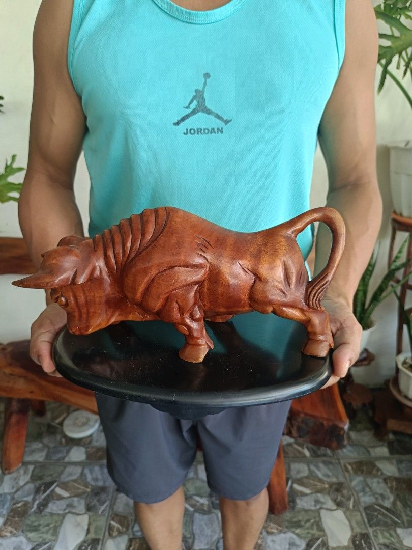 Charging Bull Wooden Statue (Category: Figurines & Statues) located in Imus. Submitted by ABrielleC (Listing ID 1462109774, Image 1). Description: Video Link https://youtube.com/shorts/tLt4oOgtniY?si=QVyP_6Ox_aWkLxlH Wood Material Plastic Base Height-5.75in Length-11.5in Width-4in Weight-0.75kg Japan Surplus Item First to pay Loc Imus Cavite.