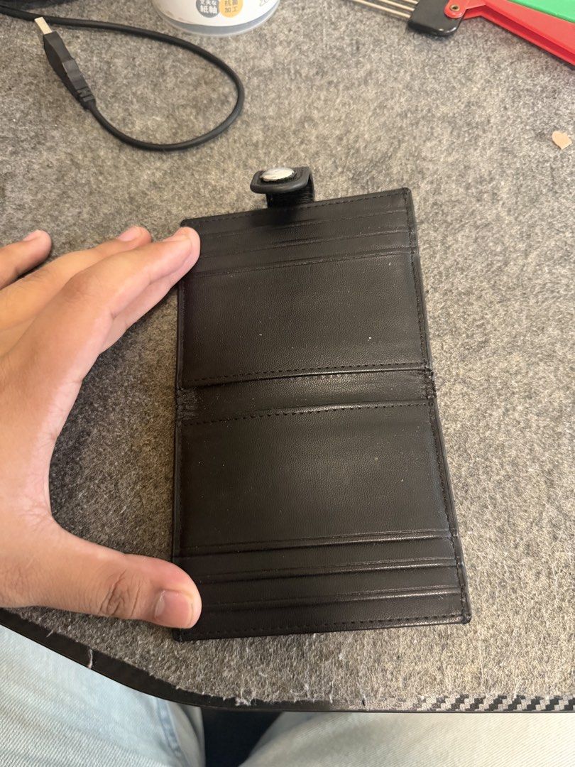 CHARLES & KEITH Black Leather Card Holder (Category: Wallets & Card holders) located in Manila. Submitted by caballeroa11402 (Listing ID 1462043997, Image 3). Description: - Brand: CHARLES & KEITH - Material: Black Leather - Features: Multiple card slots - Closure: Secure snap button - Size: Small and compact, fits easily in pockets or small bags - Ideal for: Everyday use.