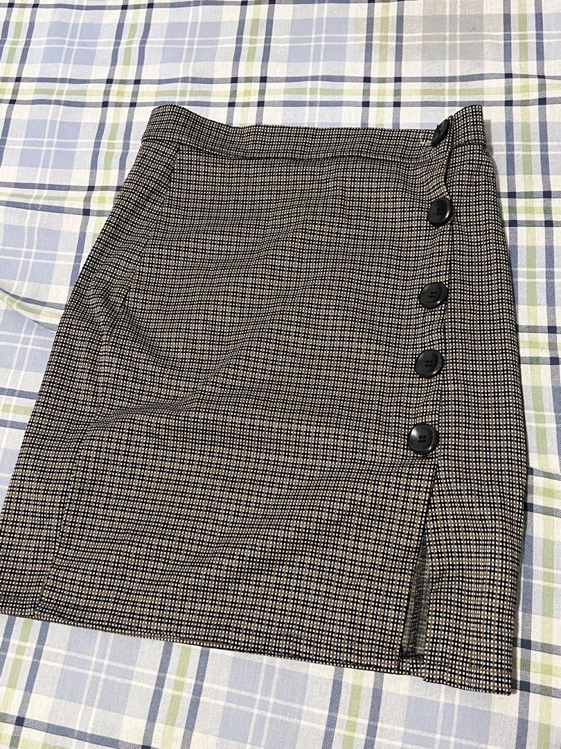 Checkered Mini Skirt with Button Detail (Category: Skirts) located in Manila. Submitted by charlotte.mae (Listing ID 1462103417, Image 1). Description: - Cute checkered mini skirt - Features a side slit - Button details down the front - Black, beige, and white color mix - Perfect for casual or dressy occasions - Easy to pair with various tops.