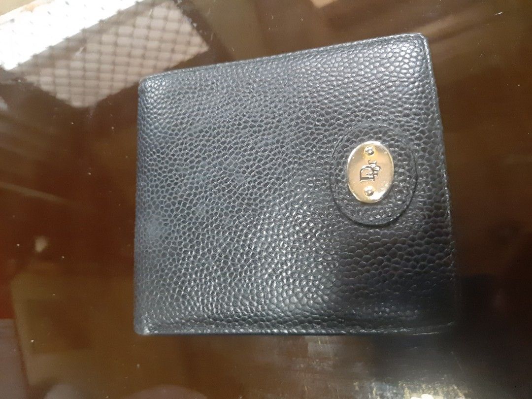 Christian Dior Black Leather Bifold Wallet (Category: Luxury Bags & Wallets) located in Bulacan. Submitted by edisoncert71953 (Listing ID 1462058837, Image 1). Description: - Authentic Christian Dior black leather bifold wallet - Multiple card slots and a coin pocket - Embossed Dior logo on the front - Christian Dior name embossed inside.