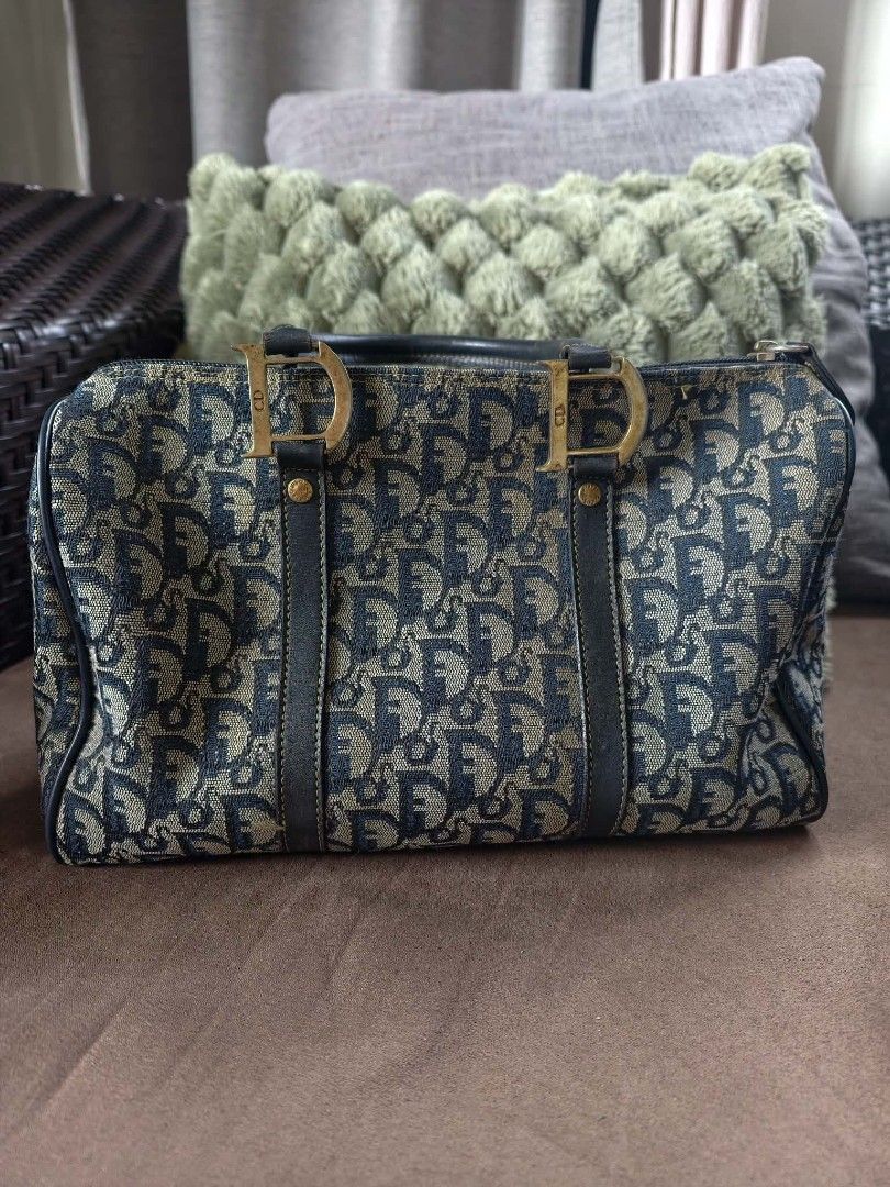 Christian Dior Monogram Boston Bag (Category: Tote Bags) located in Bacacay. Submitted by jpbellen80790 (Listing ID 1462066906, Image 1). Description: Not coded NGa - Classic Dior Boston bag - Iconic monogram pattern - Leather trim and handles - Gold-tone hardware with CD logo details - Timeless piece - Approximate measurements: 12" L x 6" H x 5" D.