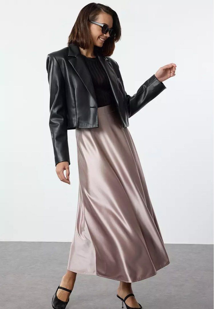 Satin Midi Skirt - Rose Gold (Category: Skirts) located in Quezon City. Submitted by getitrightaway.ph (Listing ID 1462174403, Image 2). Description: -27 waist (I’m 28 and it fits me) -Not the actual when worn photo but similar - Flowy satin midi skirt from Cider - Beautiful rose gold color - High-waisted with a flattering A-line cut - Versatile: dress up or down - Perfect for parties or a night out - Pairs well with heels or sneakers.